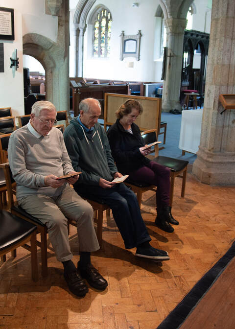 Three people in chapel
